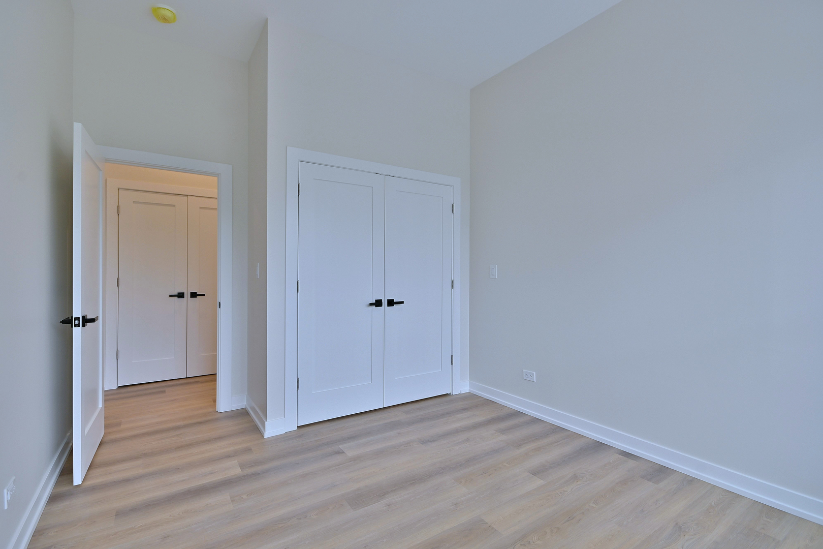 7518 Madison Street, Unit E Forest Park, IL 60130 - Photo 17 of 30 a view of an empty room and wooden floor