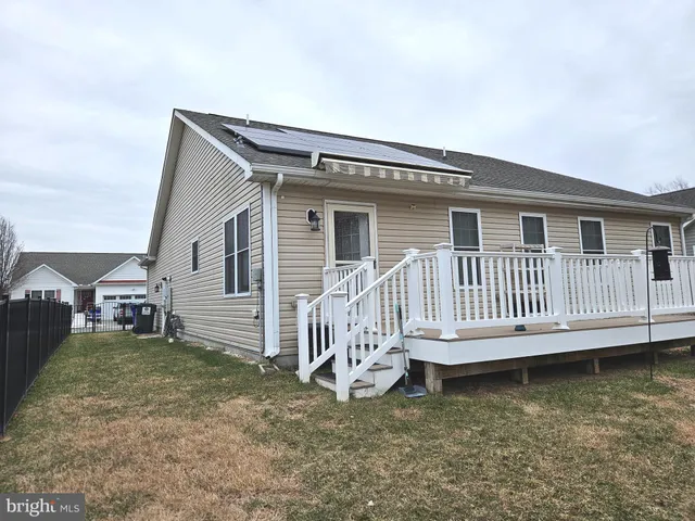a backyard of a house with a deck