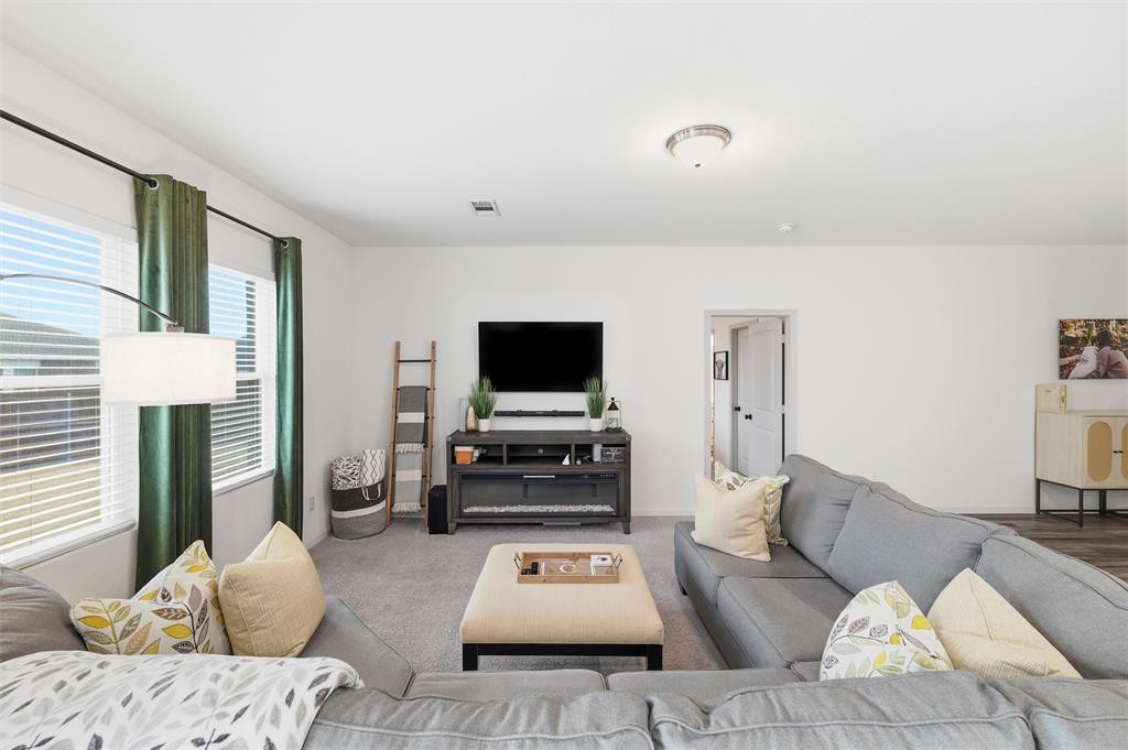 2616 Beech Crk Road Glenn Heights, TX 75154 - Photo 22 of 40 a living room with furniture and a flat screen tv