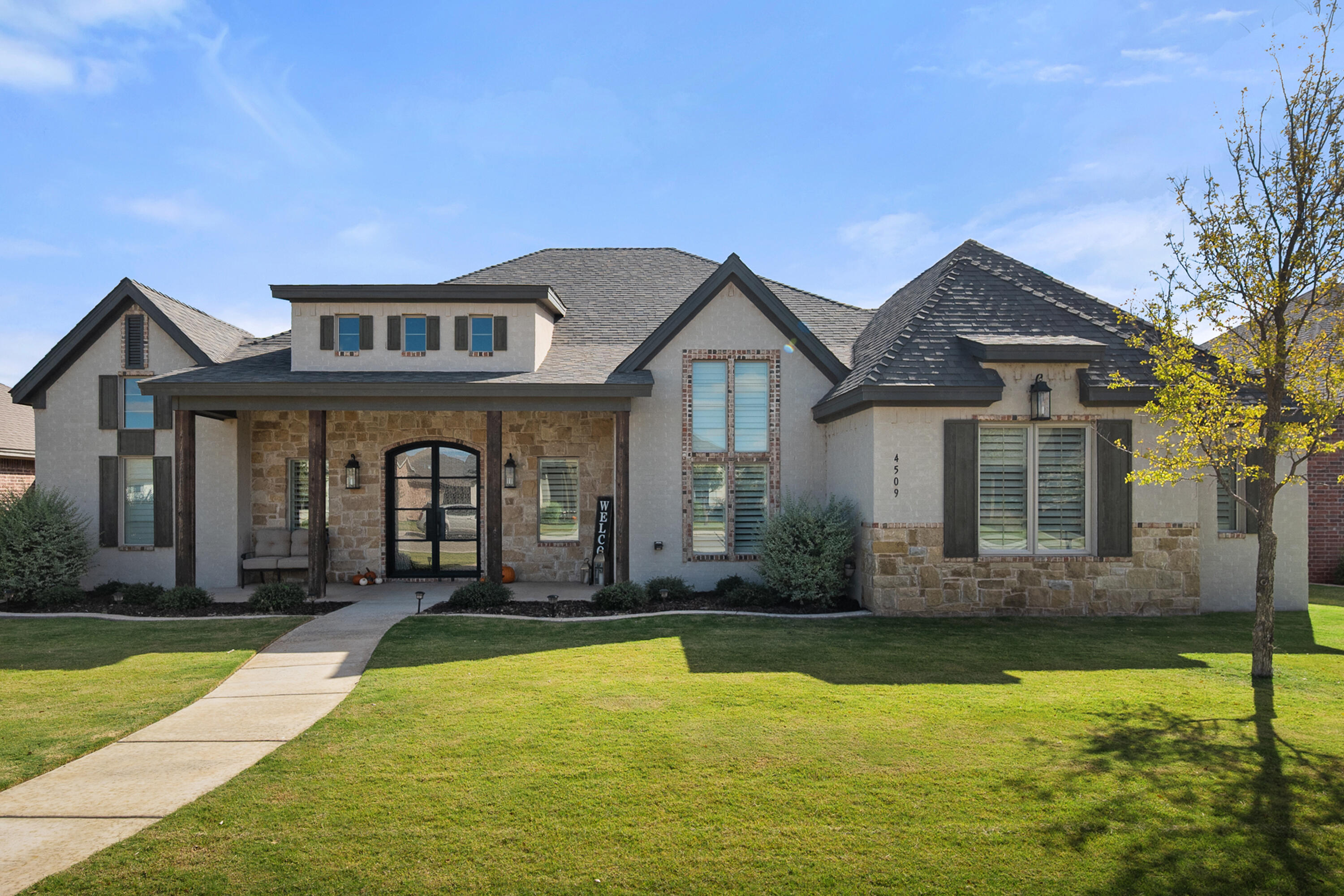 4509 140th Street Lubbock, TX 79424 - Photo 1 of 41 a front view of a house with a yard