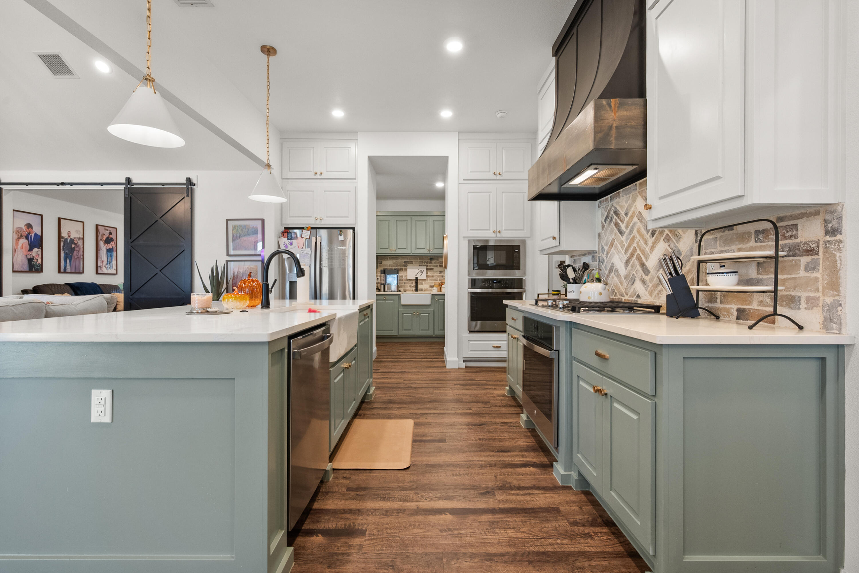 4509 140th Street Lubbock, TX 79424 - Photo 16 of 41 a kitchen with stainless steel appliances kitchen island granite countertop a stove and a sink