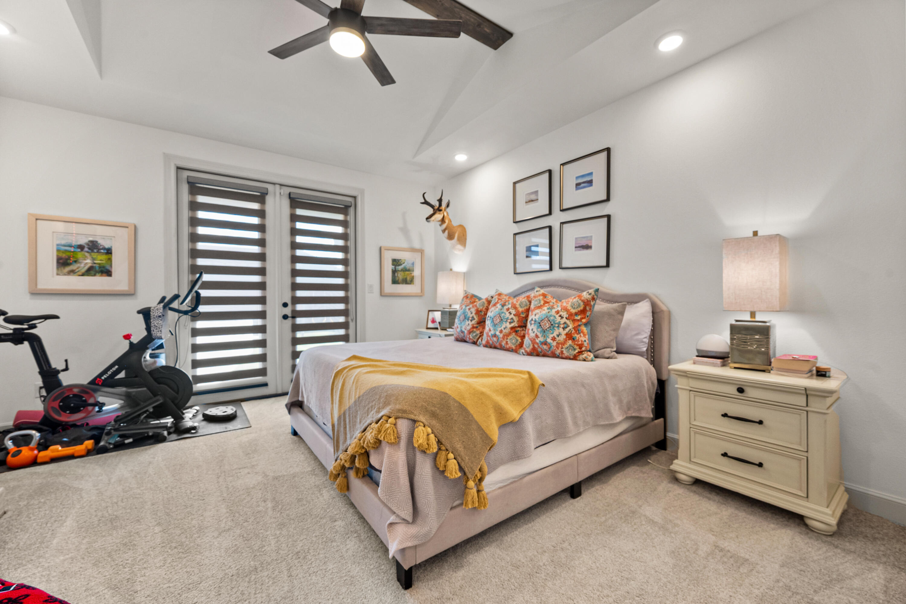 4509 140th Street Lubbock, TX 79424 - Photo 22 of 41 a spacious bedroom with a bed and a ceiling fan