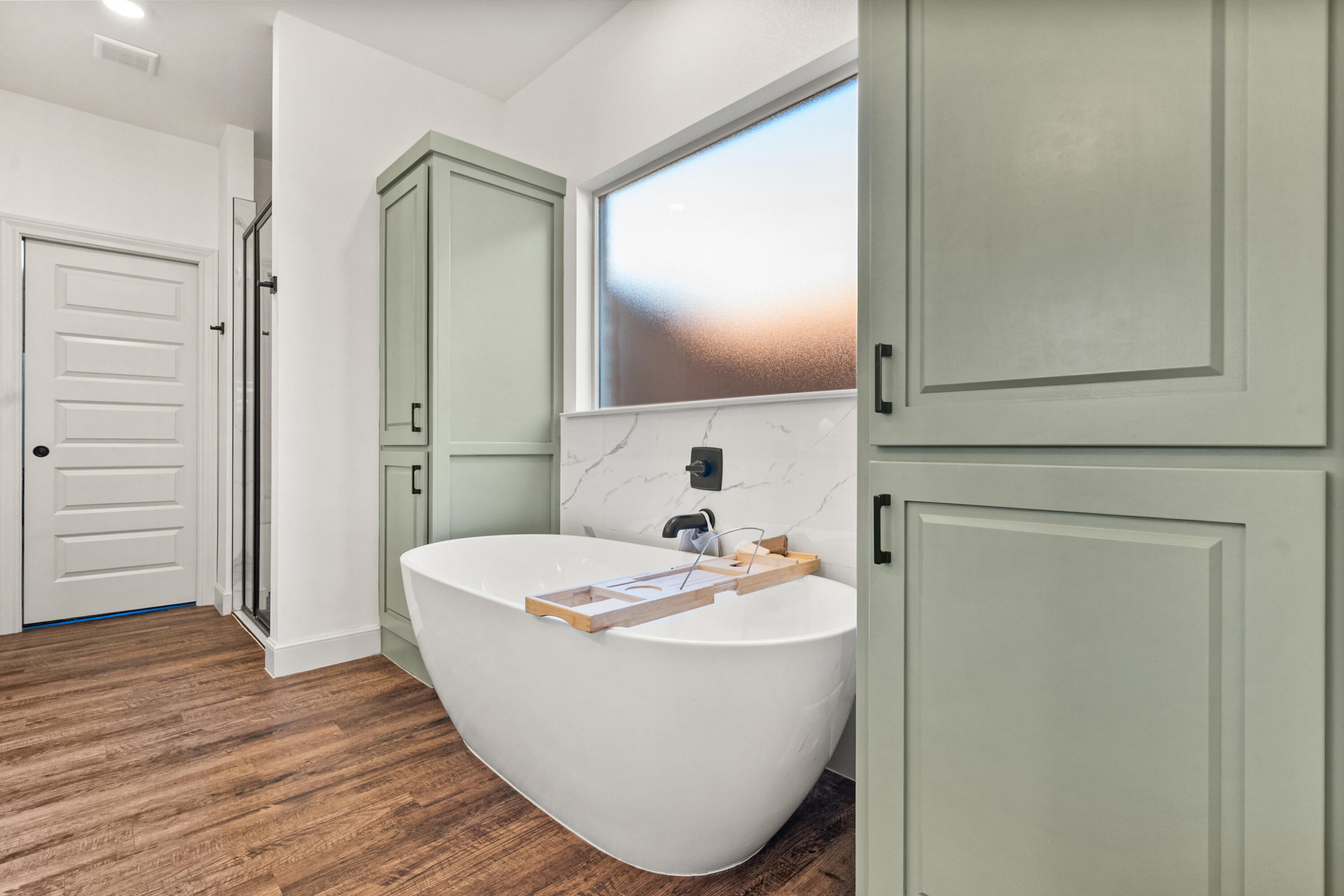 4509 140th Street Lubbock, TX 79424 - Photo 26 of 41 a bathroom with a sink and mirror