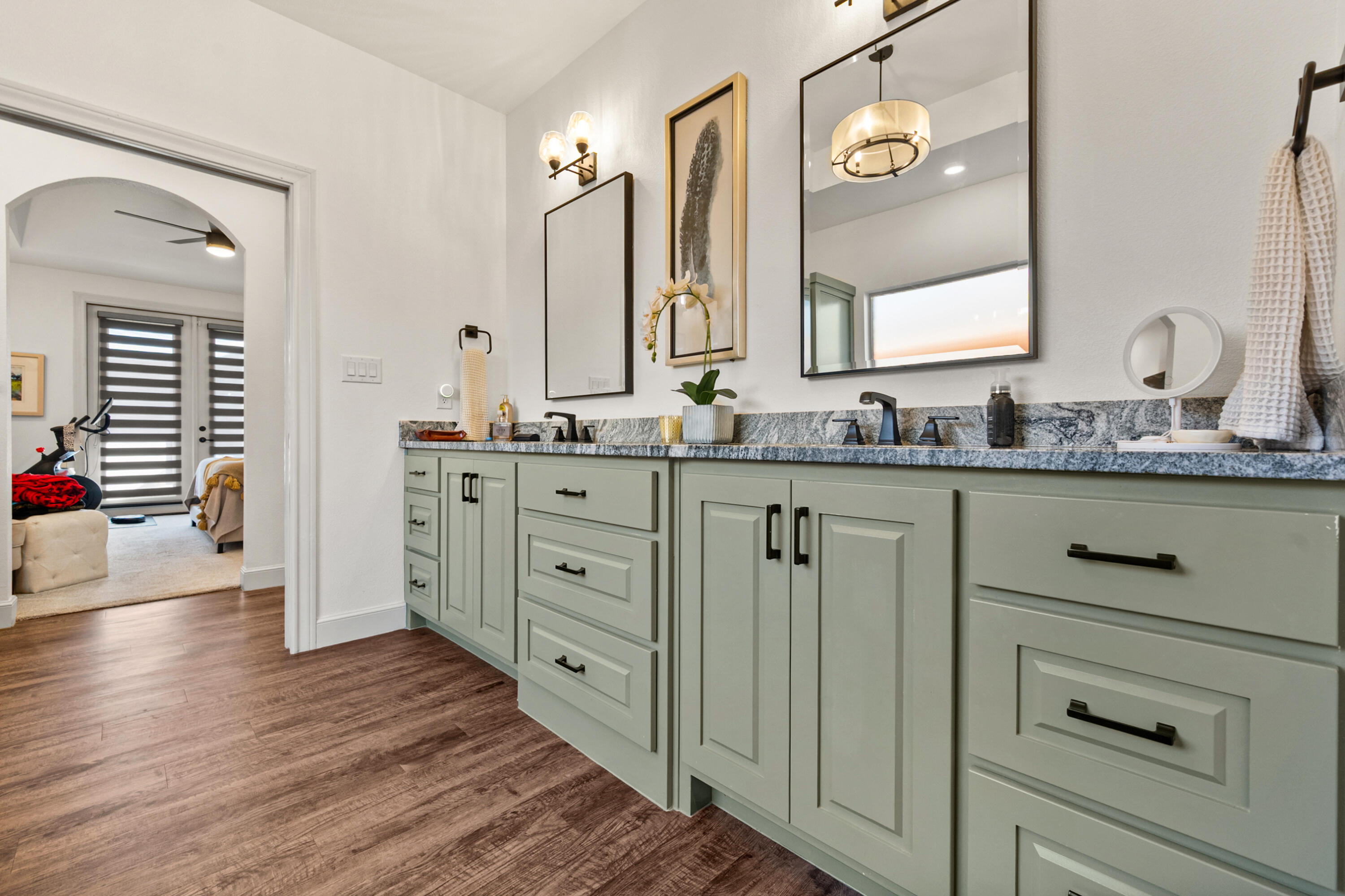 4509 140th Street Lubbock, TX 79424 - Photo 27 of 41 a bathroom with a double vanity sink and a mirror