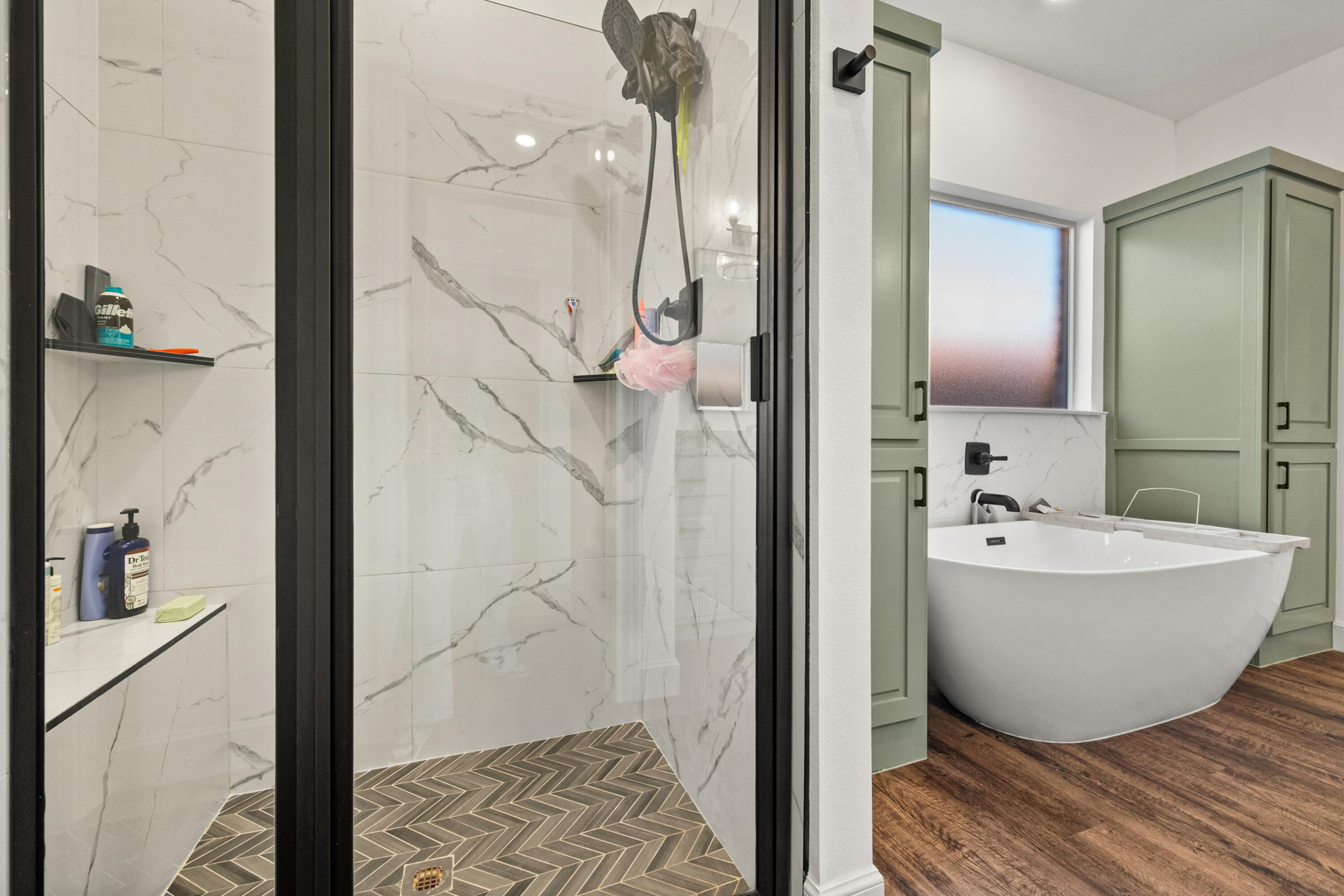 4509 140th Street Lubbock, TX 79424 - Photo 29 of 41 a bathroom with a bathtub and shower