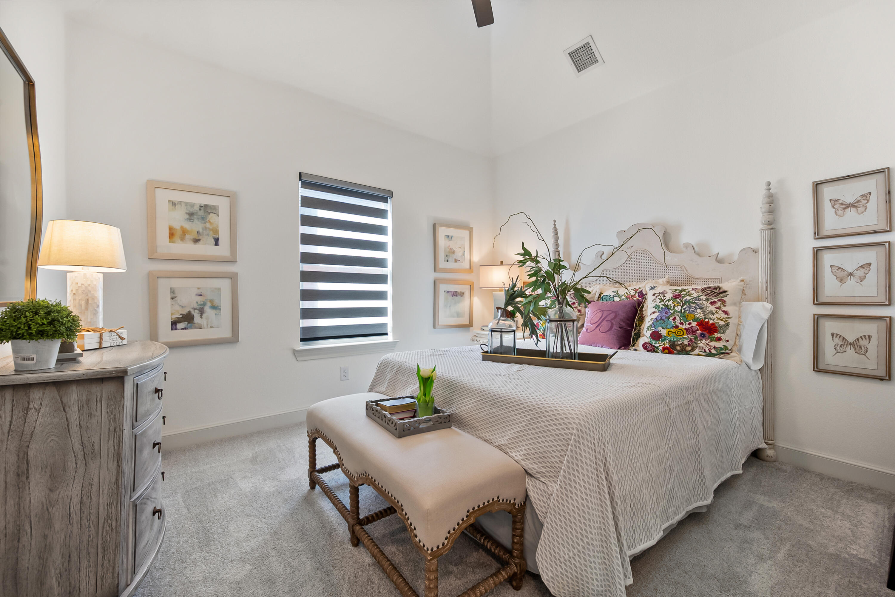 4509 140th Street Lubbock, TX 79424 - Photo 32 of 41 a bedroom that has a bed and a table in it