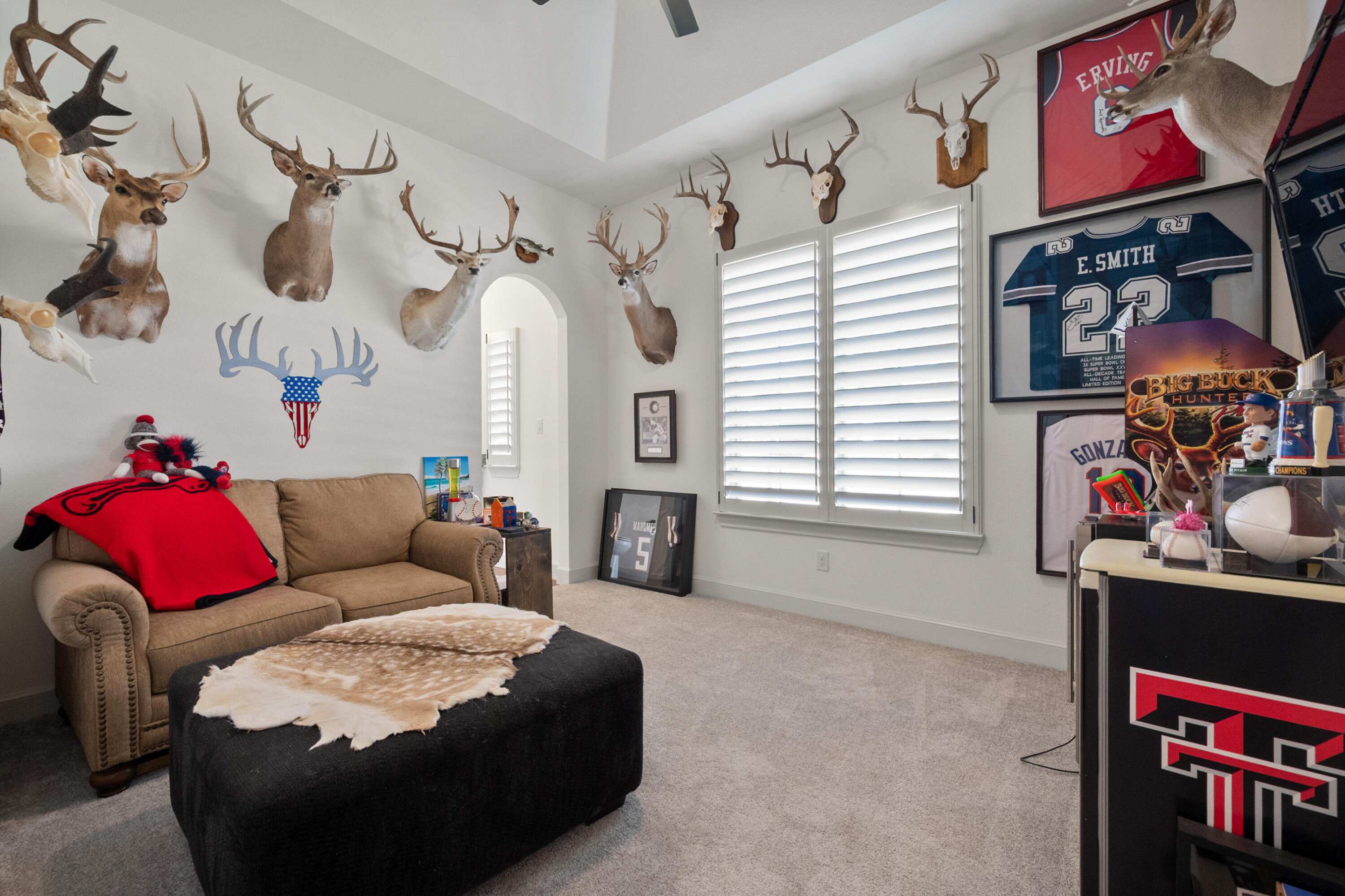 4509 140th Street Lubbock, TX 79424 - Photo 33 of 41 a living room with furniture cabinets and a window