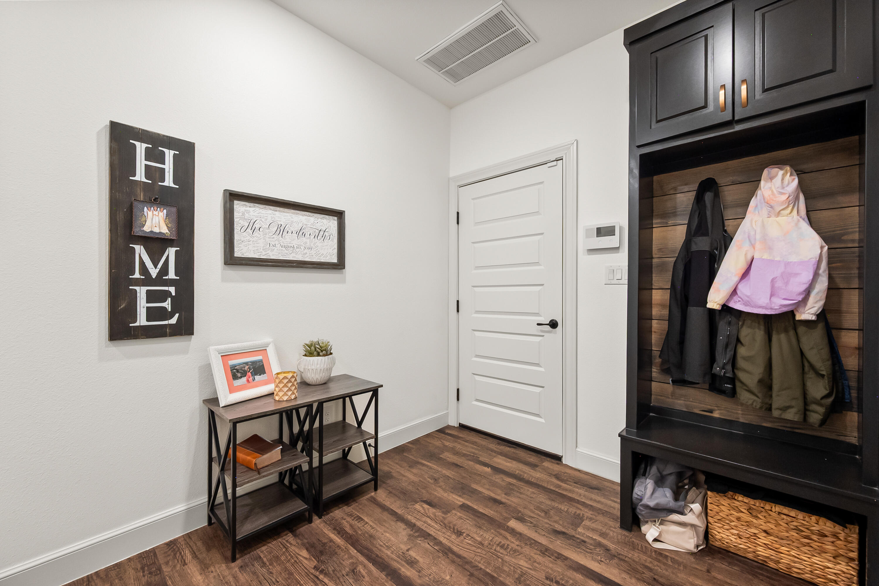 4509 140th Street Lubbock, TX 79424 - Photo 37 of 41 a view of a hallway with wooden floor and furniture