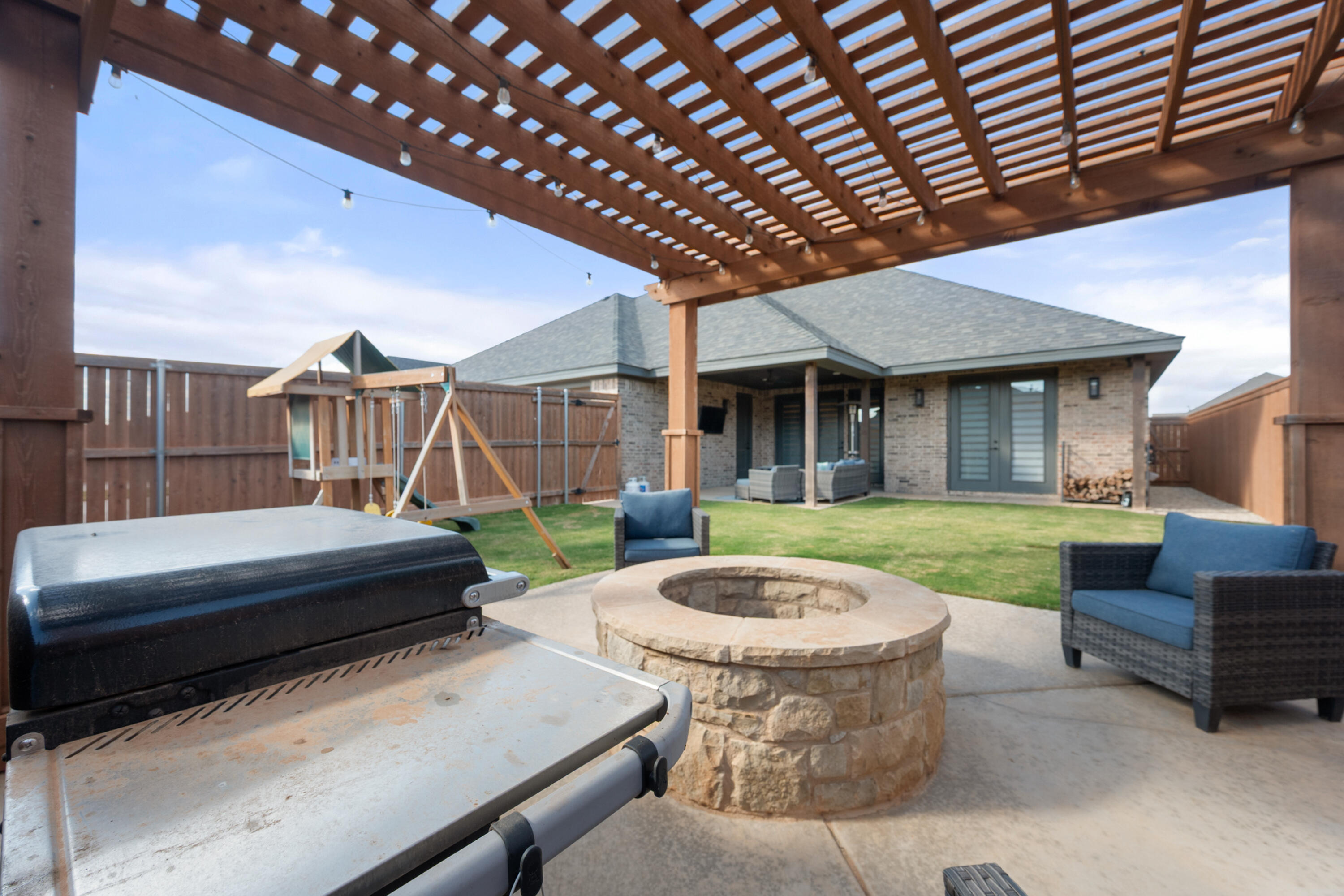4509 140th Street Lubbock, TX 79424 - Photo 40 of 41 a view of a house with a tub and a backyard