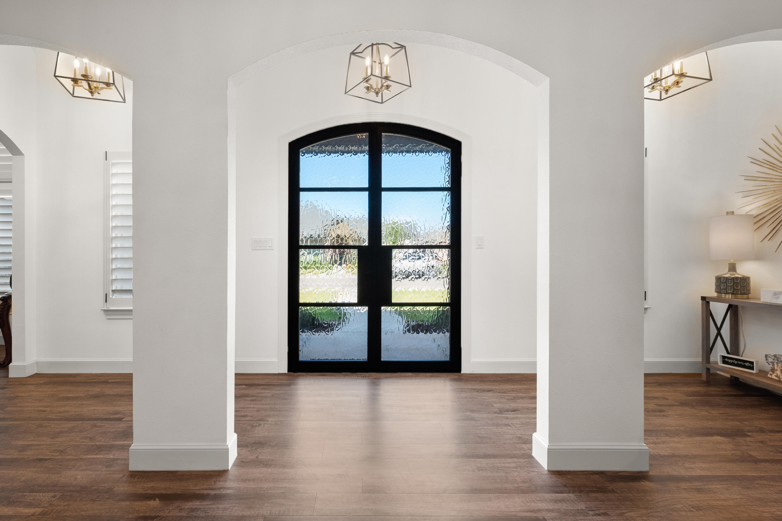 4509 140th Street Lubbock, TX 79424 - Photo 5 of 41 an empty room with wooden floor and windows
