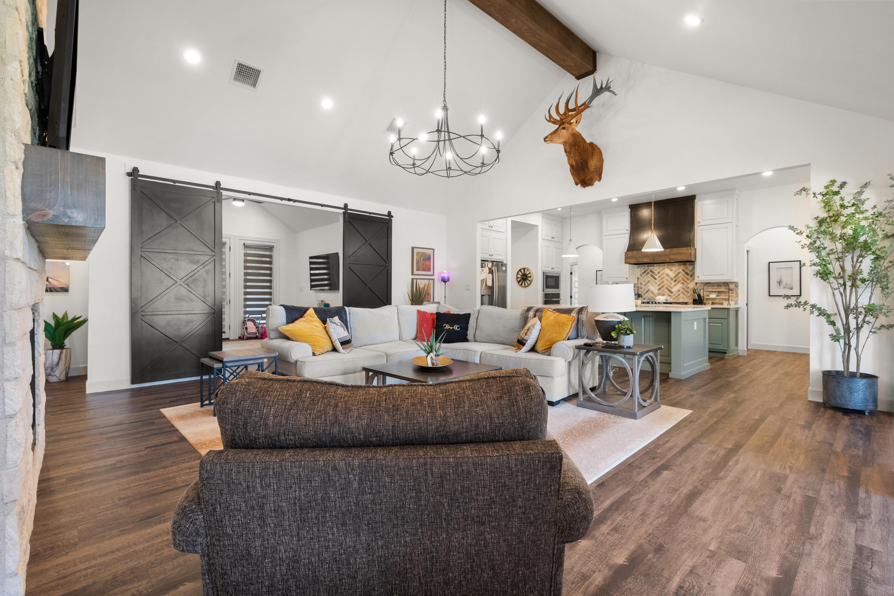 4509 140th Street Lubbock, TX 79424 - Photo 7 of 41 a living room with fireplace furniture and a wooden floor