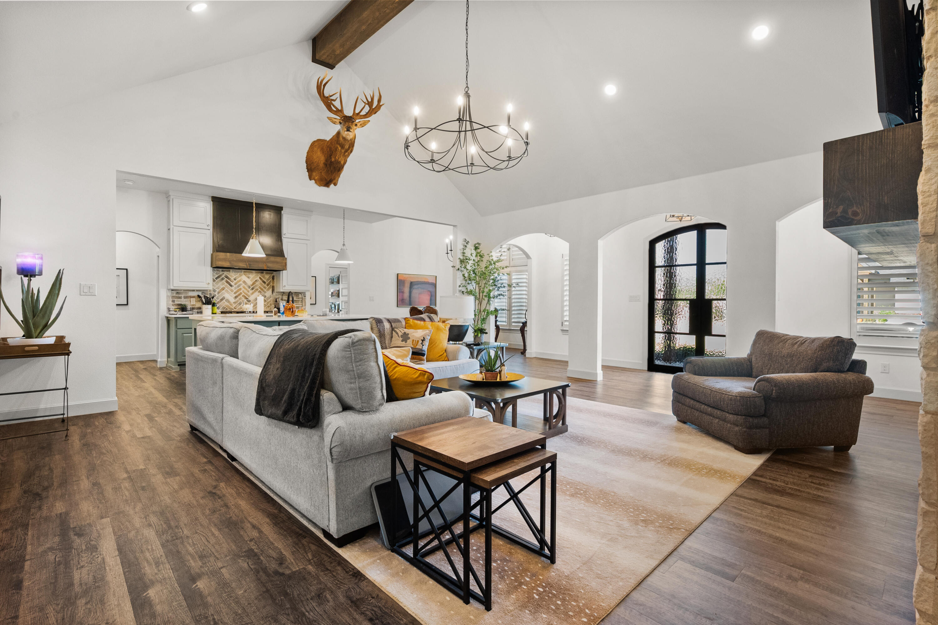 4509 140th Street Lubbock, TX 79424 - Photo 8 of 41 a living room with fireplace furniture and a flat screen tv