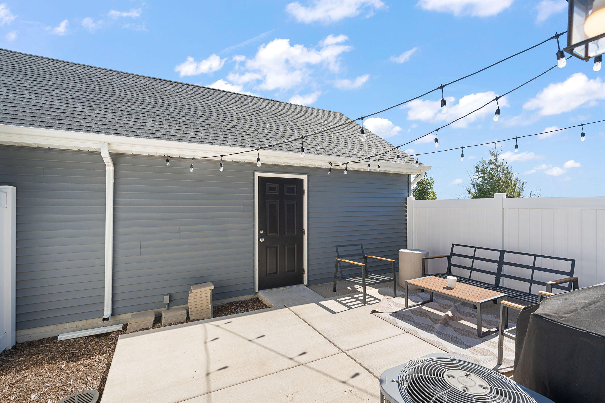 11897 Rhode Island Street Crown Point, IN 46307 - Photo 17 of 21 a view of a patio with a table and chairs and potted plants