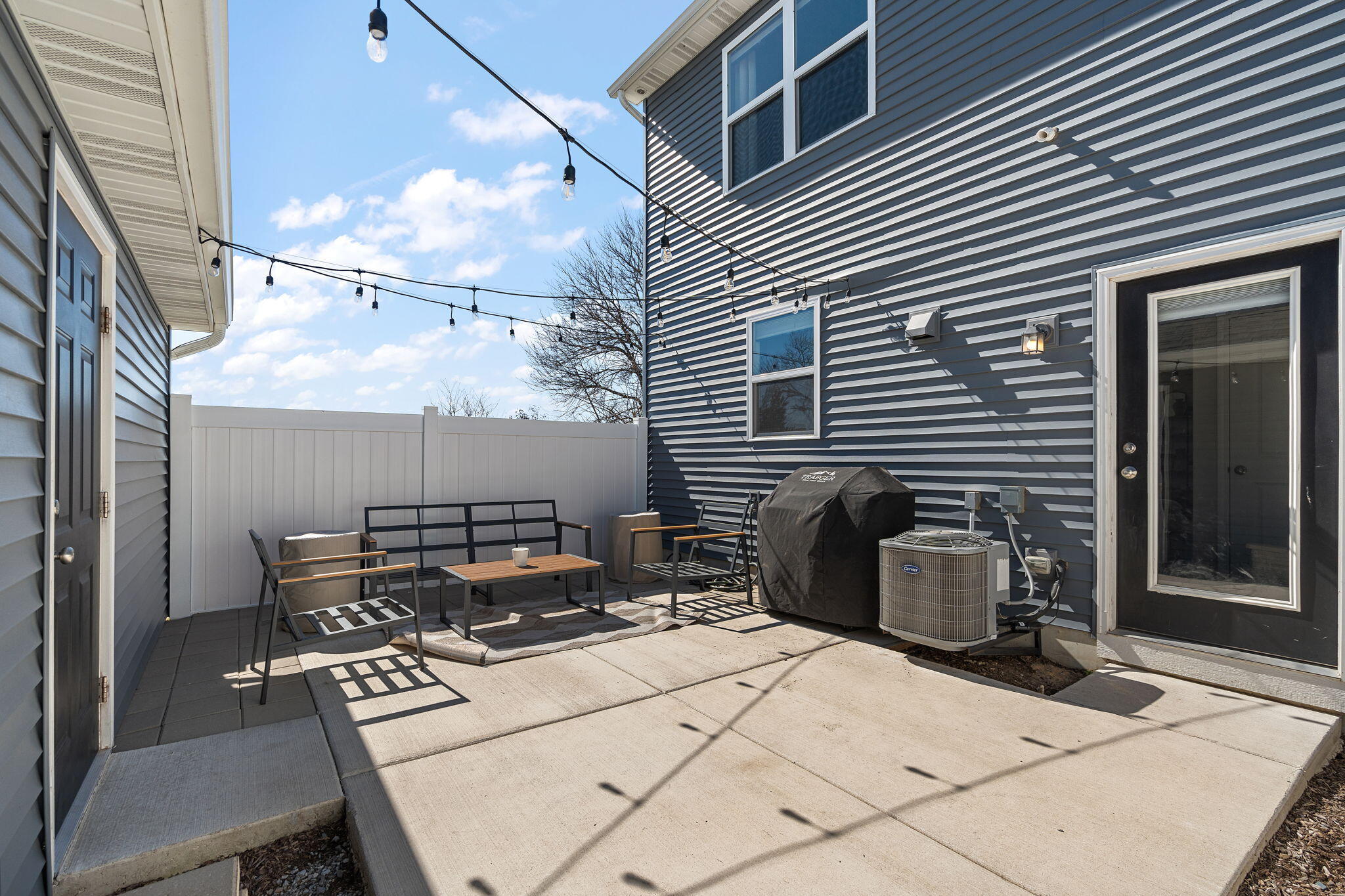 11897 Rhode Island Street Crown Point, IN 46307 - Photo 18 of 21 a view of a patio with table and chairs and barbeque