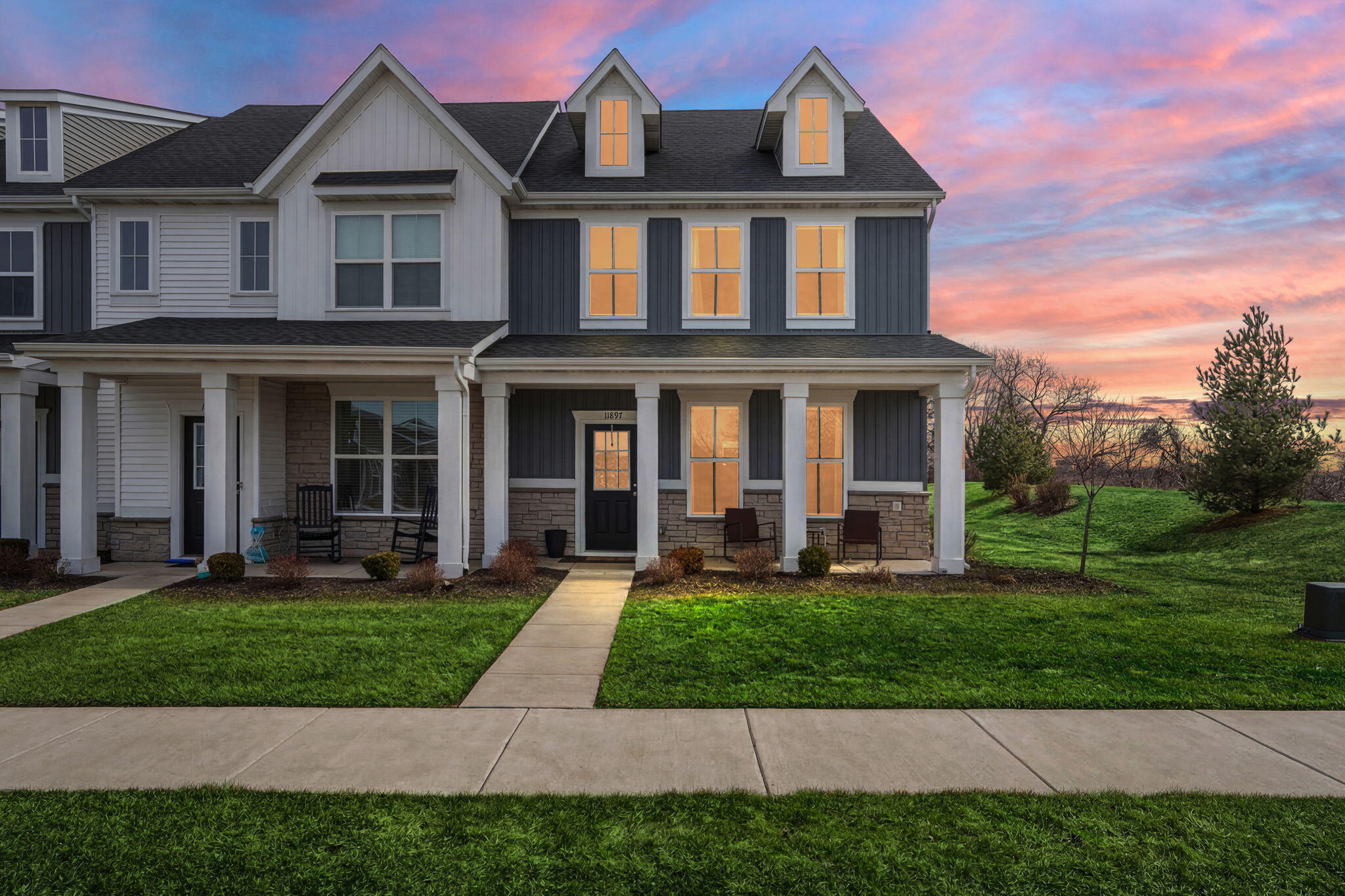11897 Rhode Island Street Crown Point, IN 46307 - Photo 2 of 21 a front view of a house with a yard