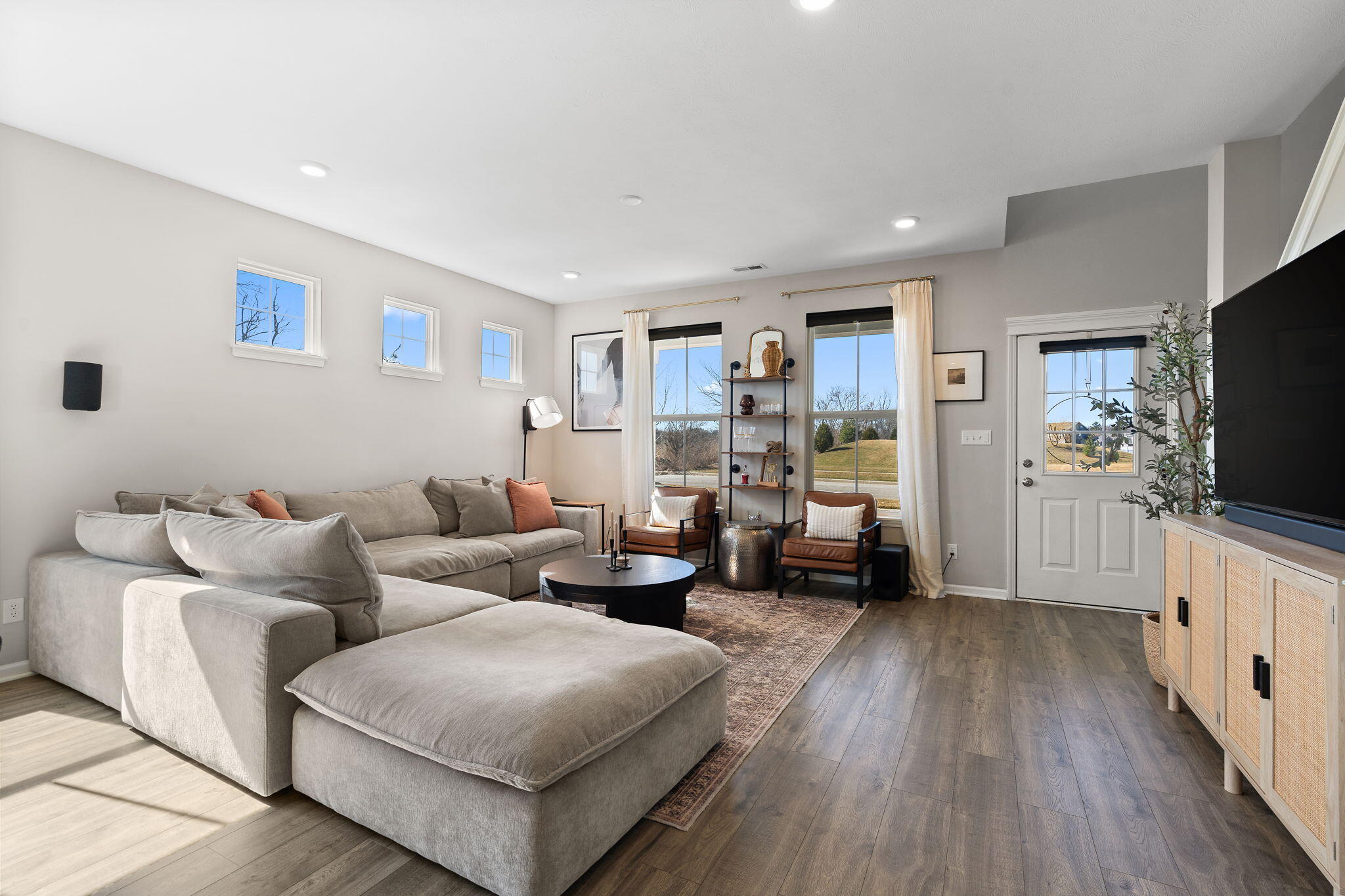 11897 Rhode Island Street Crown Point, IN 46307 - Photo 5 of 21 a living room with furniture and a flat screen tv