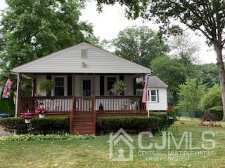 707 Spruce Road North Brunswick, NJ 08902 - Photo 1 of 23 a front view of a house with a yard