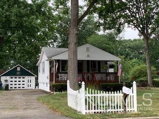 707 Spruce Road North Brunswick, NJ 08902 - Photo 2 of 23 a view of a house with a small yard and wooden fence