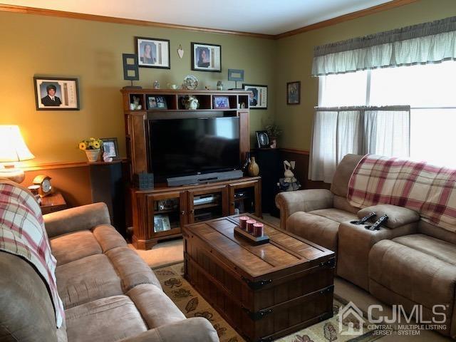 707 Spruce Road North Brunswick, NJ 08902 - Photo 16 of 23 a living room with furniture and a flat screen tv