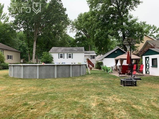 707 Spruce Road North Brunswick, NJ 08902 - Photo 19 of 23 a view of a house with a yard patio and a slide
