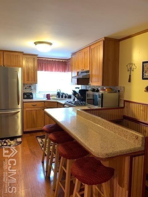 707 Spruce Road North Brunswick, NJ 08902 - Photo 3 of 23 a kitchen with stainless steel appliances granite countertop a sink a stove a refrigerator a counter top space and cabinets
