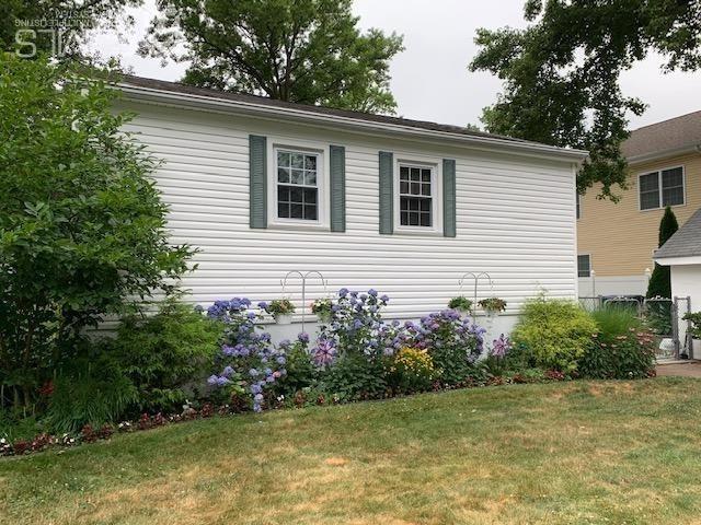 707 Spruce Road North Brunswick, NJ 08902 - Photo 22 of 23 a view of a house with a yard