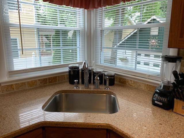 707 Spruce Road North Brunswick, NJ 08902 - Photo 4 of 23 a kitchen with a sink and a window