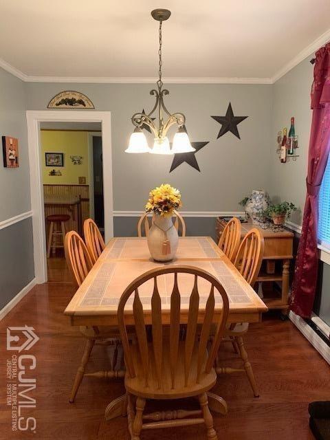 707 Spruce Road North Brunswick, NJ 08902 - Photo 6 of 23 a view of a dining room with furniture and chandelier