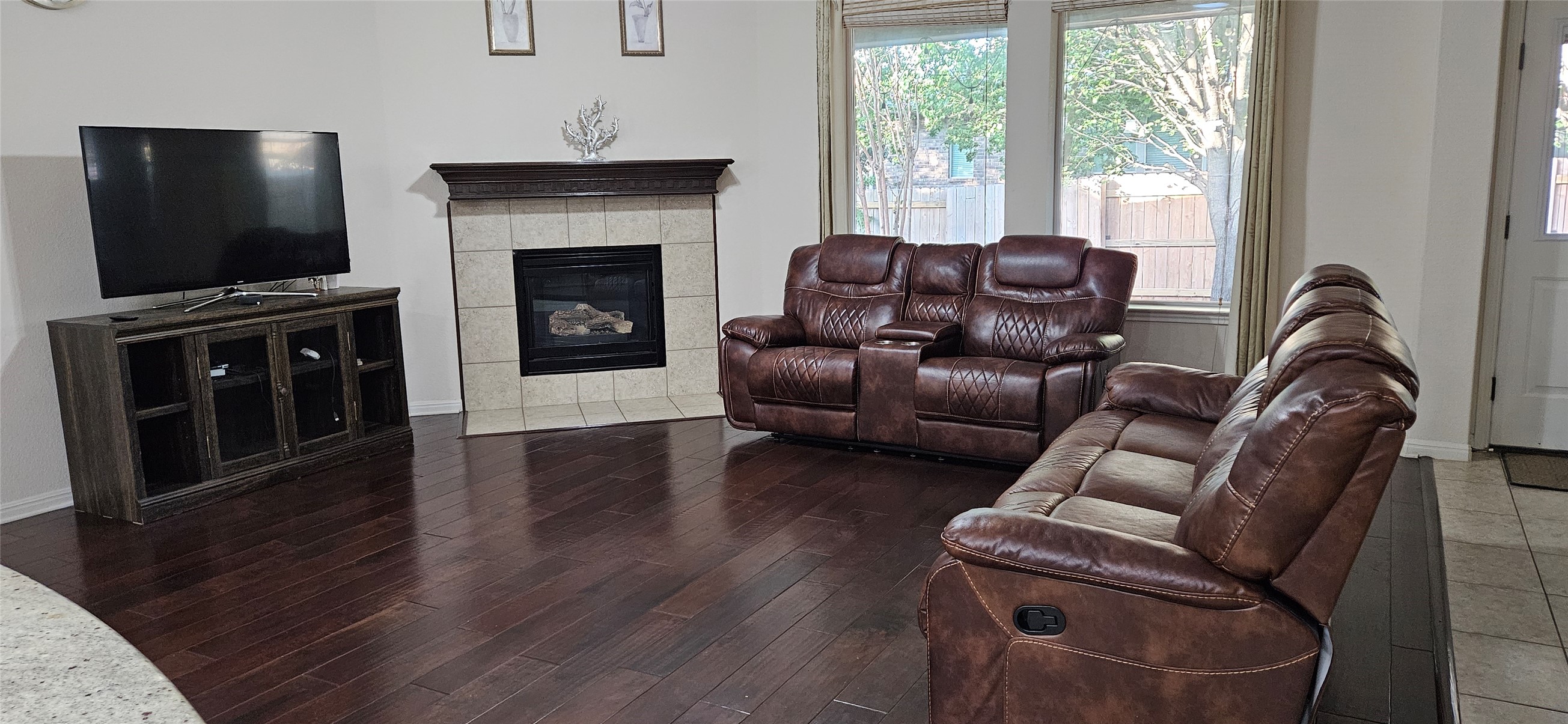 116 Azimuth Drive Austin, TX 78717 - Photo 27 of 33 a living room with furniture a flat screen tv and a fireplace