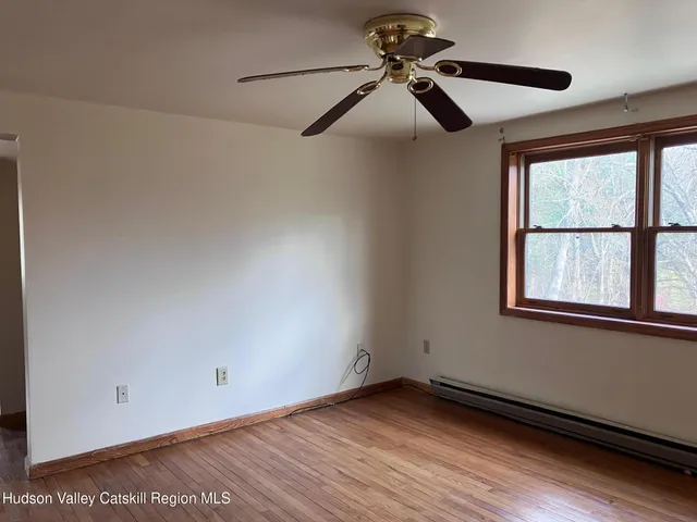 a view of an empty room and window