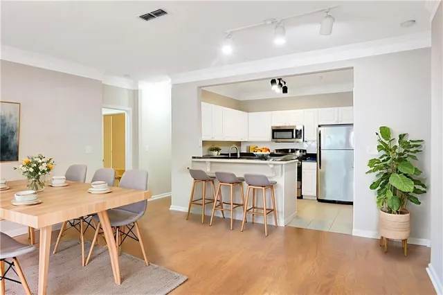 a kitchen with a table and chairs in it