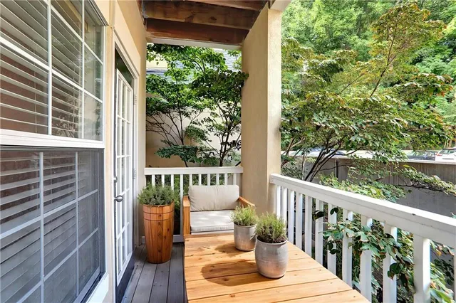 a view of a balcony with wooden floor
