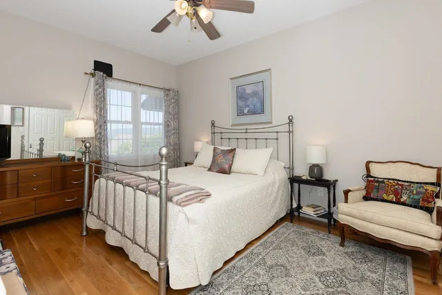 a bedroom with a bed and flat screen tv