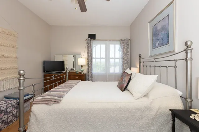 a bedroom with a bed and a dresser