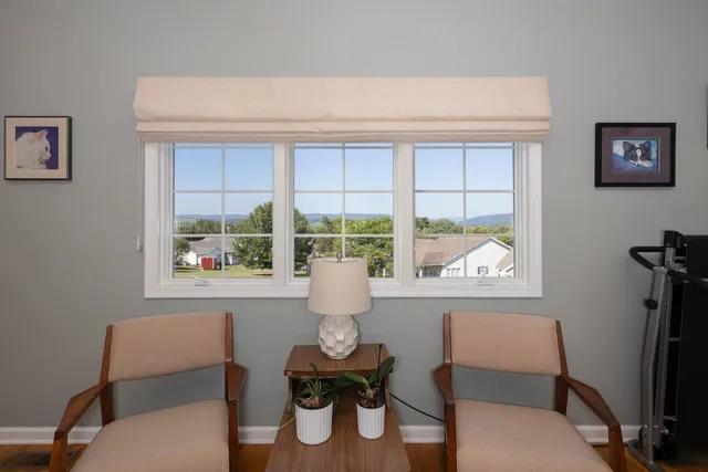 a living room with furniture window and piano table
