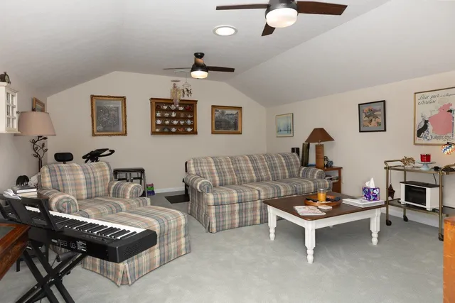 a bedroom with furniture and a flat screen tv