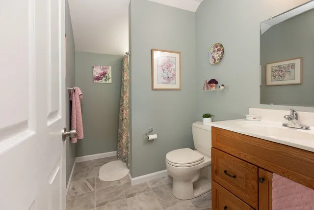 a bathroom with a sink vanity and a mirror