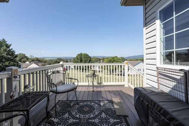 a front view of a house with outdoor seating