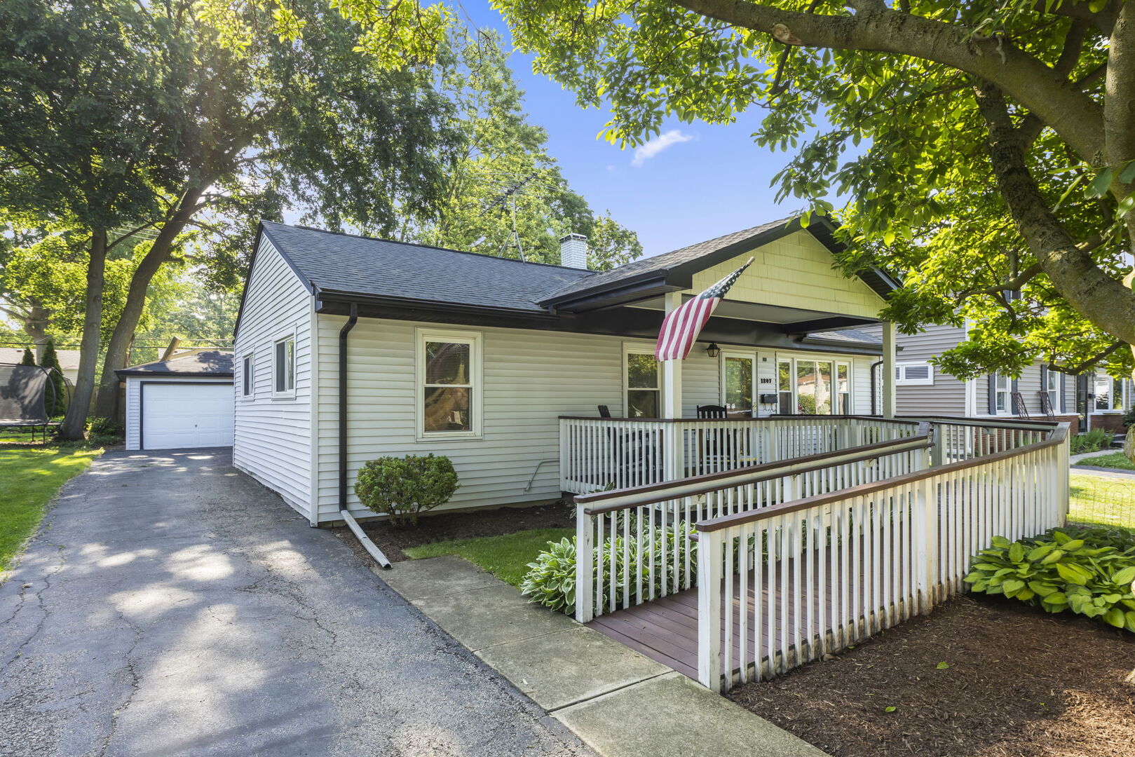 1207 South Sumner Street Wheaton, IL 60189 - Photo 1 of 1 a view of a house with a small yard and a large tree