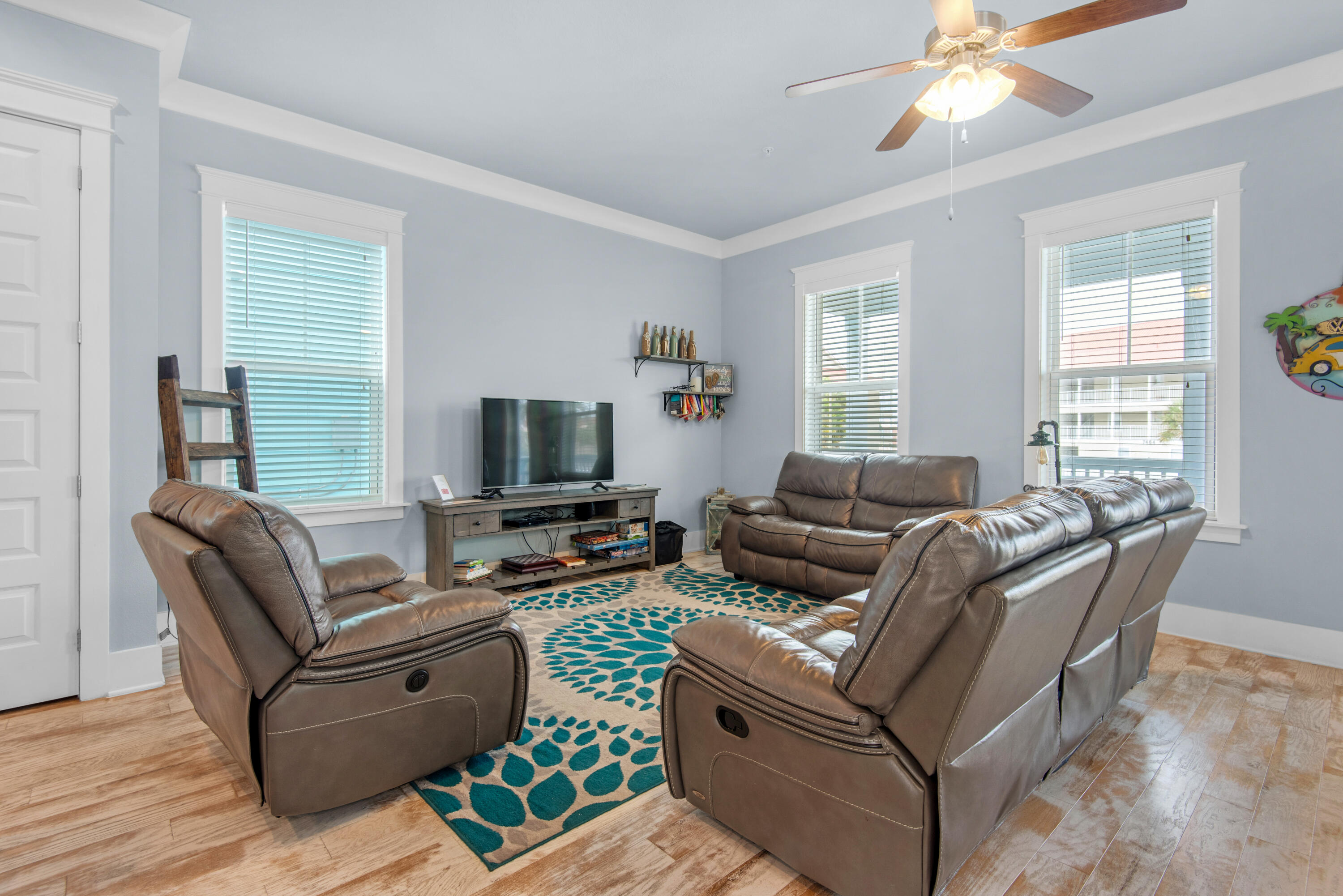 1494 Seaside Circle Navarre, FL 32566 - Photo 11 of 69 a living room with furniture and a flat screen tv