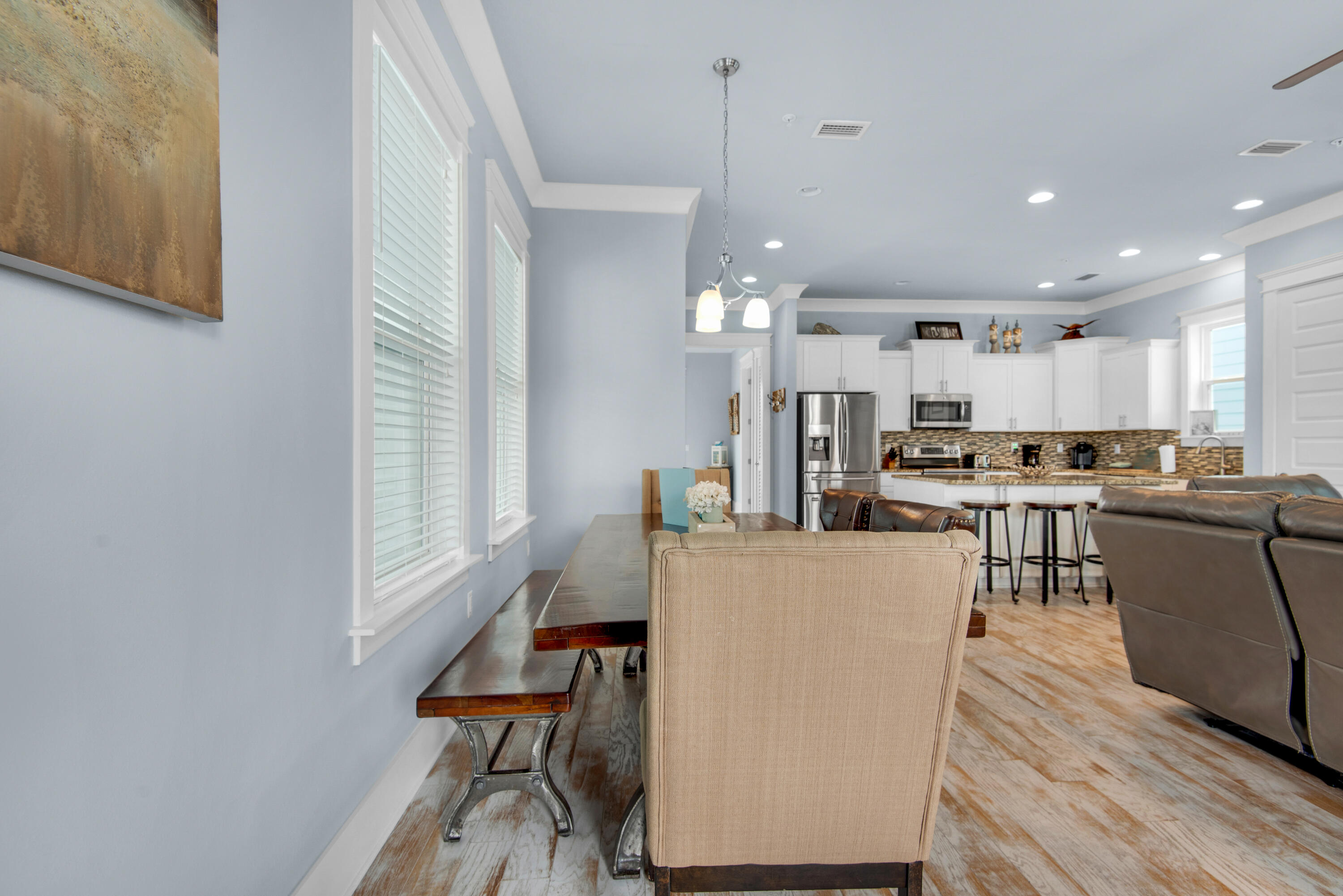 1494 Seaside Circle Navarre, FL 32566 - Photo 14 of 69 a living room with stainless steel appliances kitchen island granite countertop furniture a rug a fireplace and a window