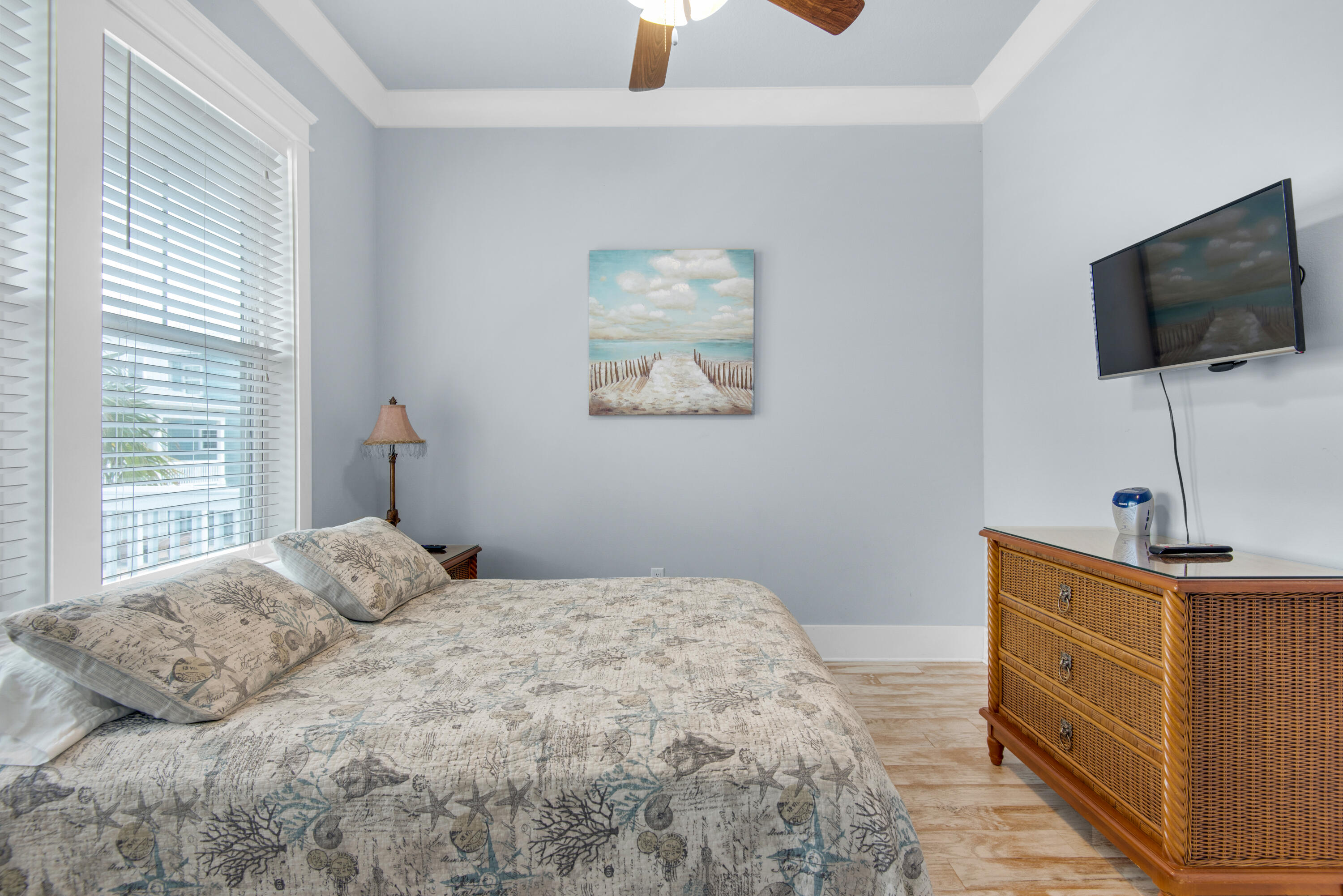 1494 Seaside Circle Navarre, FL 32566 - Photo 18 of 69 a bedroom with a bed and a flat screen tv