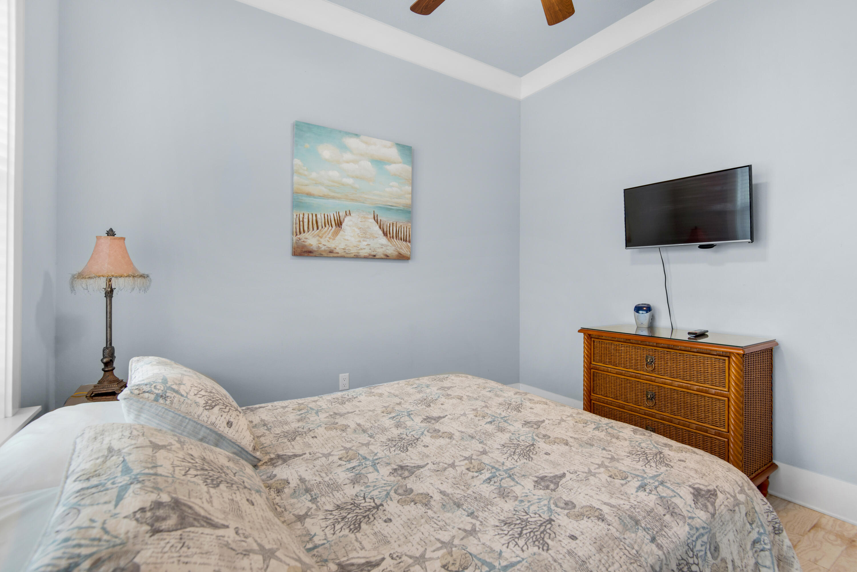1494 Seaside Circle Navarre, FL 32566 - Photo 19 of 69 a bedroom with a bed and a flat screen tv