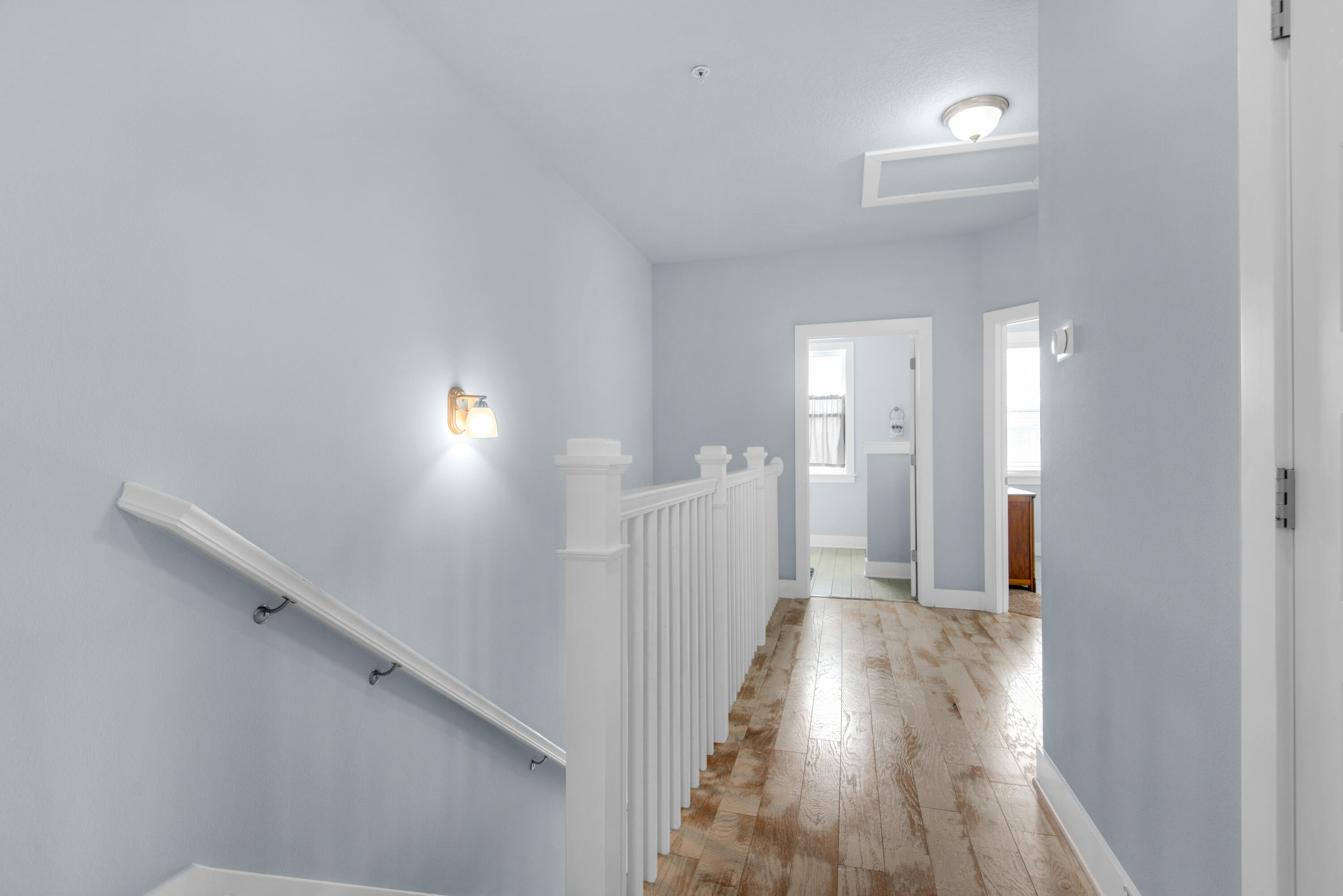 1494 Seaside Circle Navarre, FL 32566 - Photo 21 of 69 a view of a hallway with wooden floor
