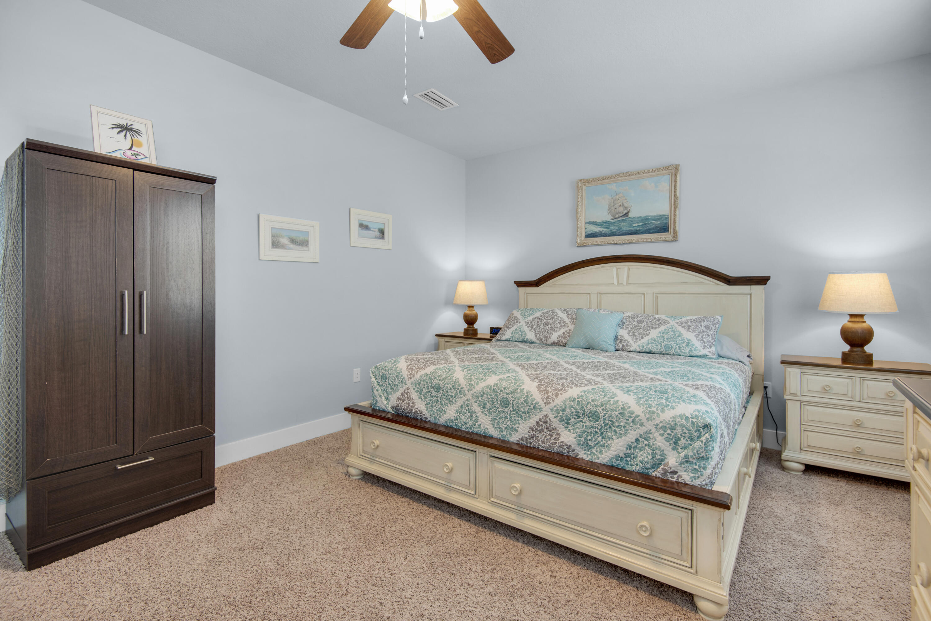 1494 Seaside Circle Navarre, FL 32566 - Photo 24 of 69 a bedroom with a bed and a night stand