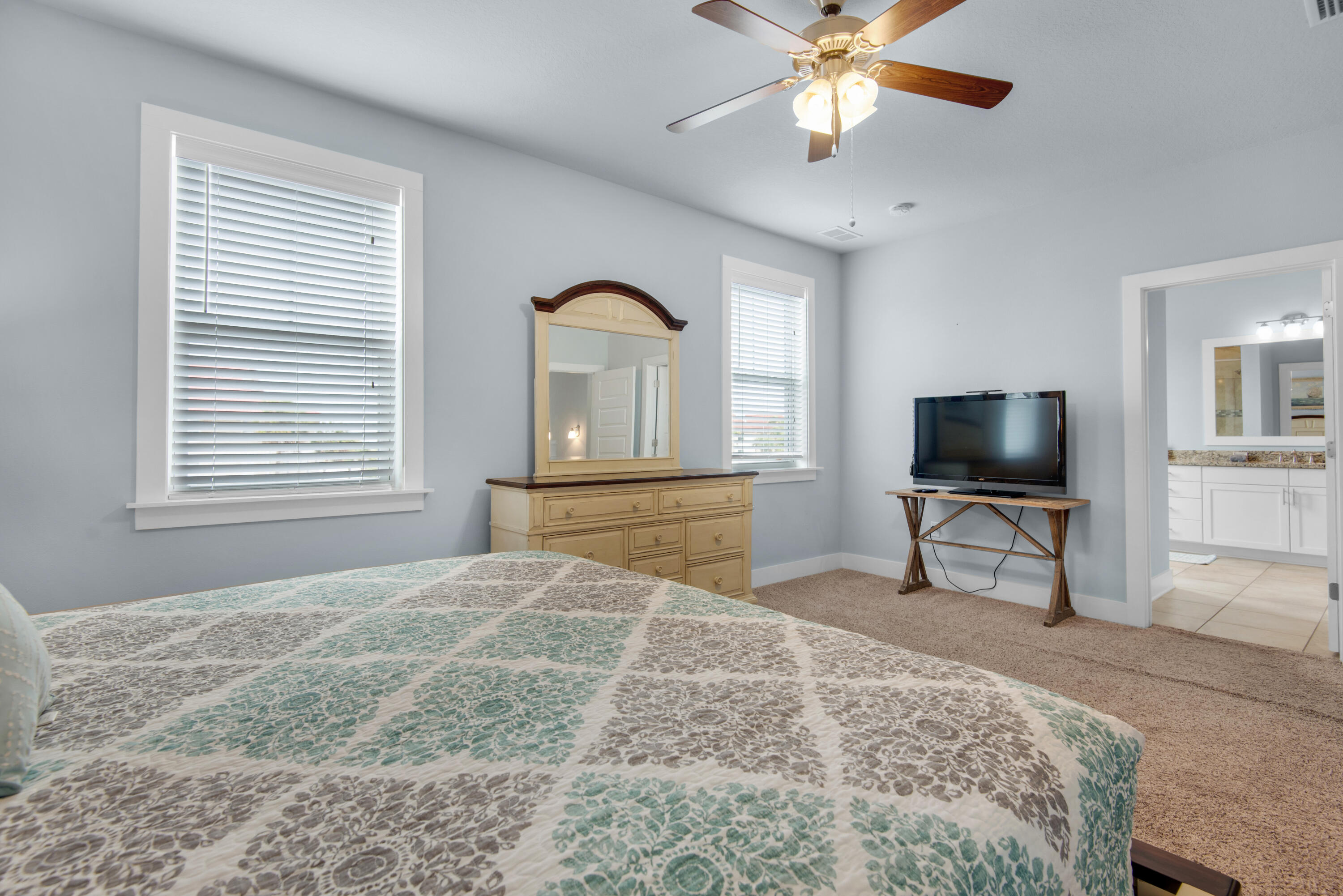 1494 Seaside Circle Navarre, FL 32566 - Photo 25 of 69 a bedroom with a bed and a flat screen tv