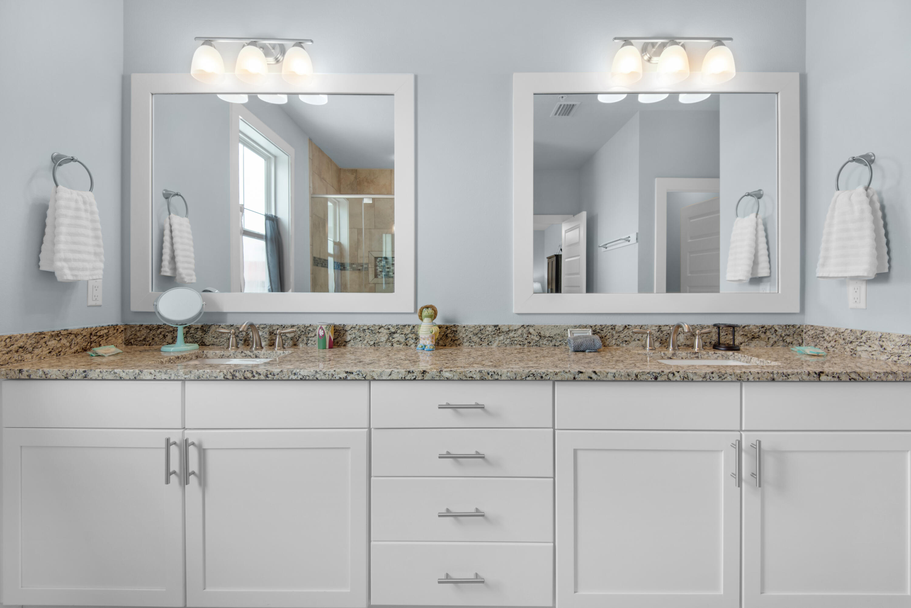 1494 Seaside Circle Navarre, FL 32566 - Photo 26 of 69 a bathroom with a sink and a mirror