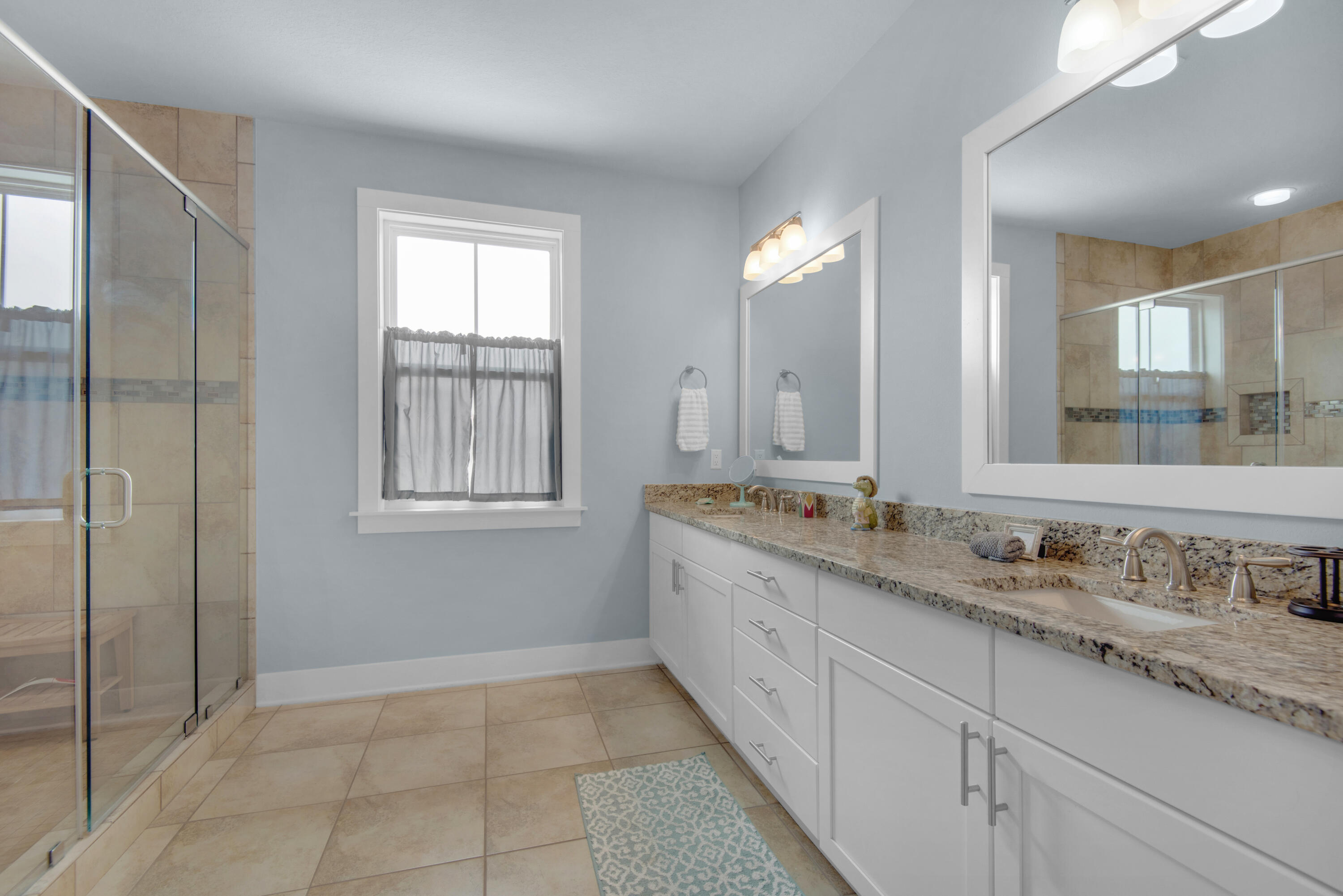 1494 Seaside Circle Navarre, FL 32566 - Photo 28 of 69 a bathroom with a granite countertop sink mirror and double