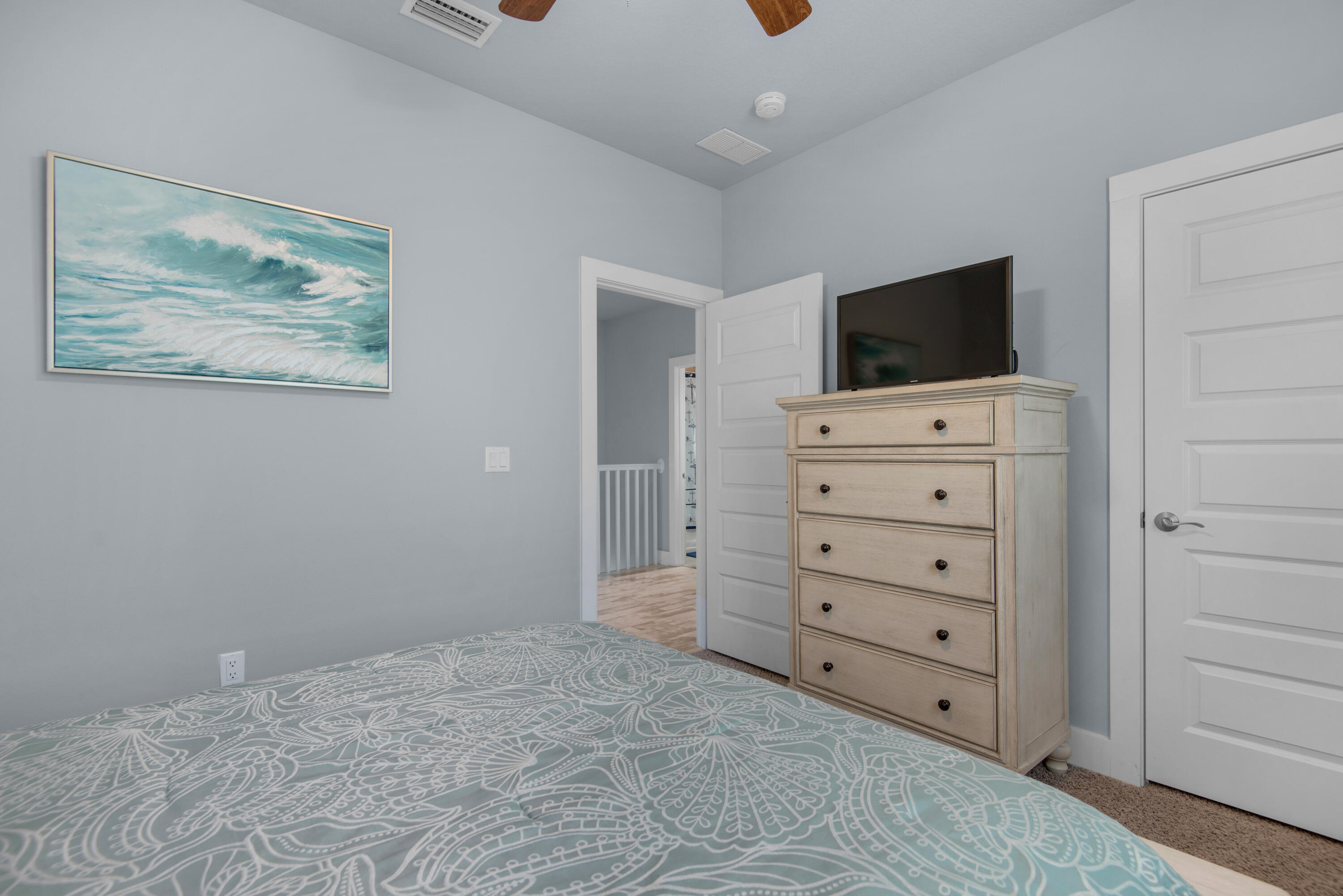 1494 Seaside Circle Navarre, FL 32566 - Photo 31 of 69 a room with a television and a dresser