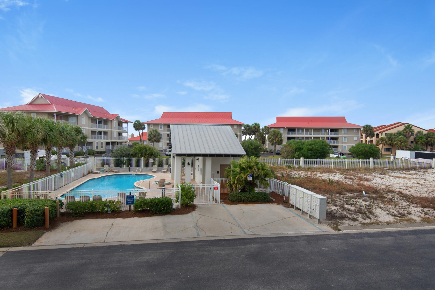 1494 Seaside Circle Navarre, FL 32566 - Photo 41 of 69 a front view of a house with a yard and outdoor seating